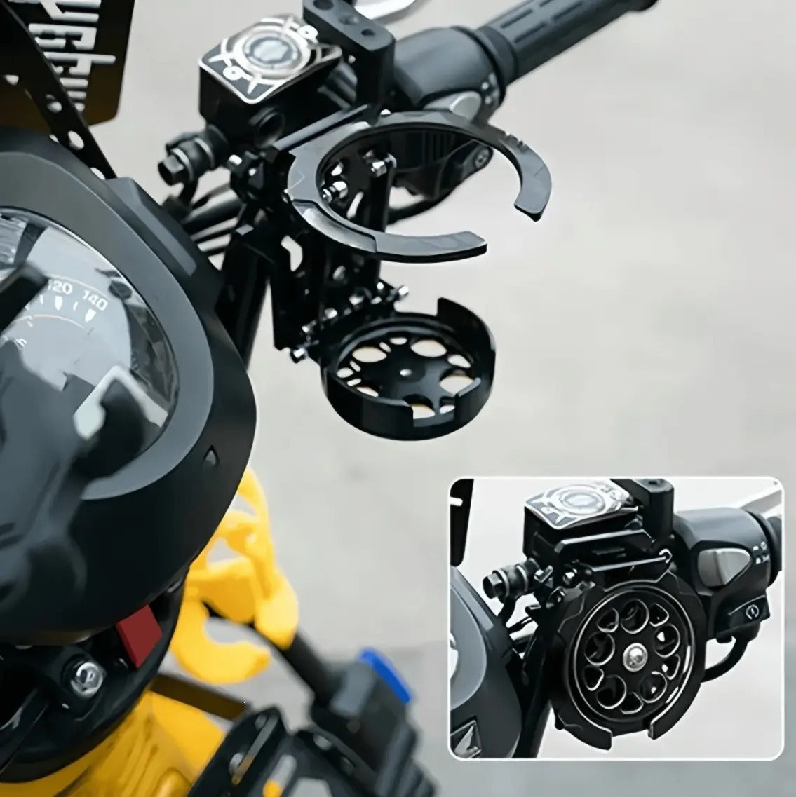 Close-up of the RideCup clamped to a motorcycle handlebar, inset showing it folded flat.