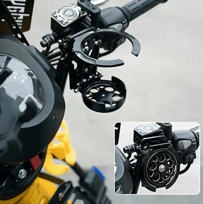Close-up of the RideCup clamped to a motorcycle handlebar, inset showing it folded flat.